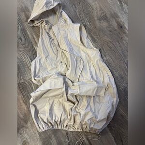 Cream beige vest dress that can be made loose or tight at the bottom